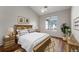 Charming bedroom boasts a large window, neutral walls, and stylish decor at 3205 E 102Nd Pl, Thornton, CO 80229