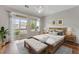 Charming bedroom with balcony access, area rug, and modern decor at 3205 E 102Nd Pl, Thornton, CO 80229