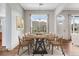 Bright dining room features a decorative chandelier and large window overlooking the front yard at 3205 E 102Nd Pl, Thornton, CO 80229