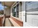 Inviting front porch with brick accents and a well-maintained entrance at 3205 E 102Nd Pl, Thornton, CO 80229