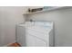 Convenient laundry area features washer, dryer, and shelf at 3205 E 102Nd Pl, Thornton, CO 80229