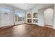 Inviting living room featuring a cozy fireplace, archways and ample natural light at 3205 E 102Nd Pl, Thornton, CO 80229