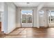 Bright living room area features a decorative chandelier and large window overlooking the front yard at 3205 E 102Nd Pl, Thornton, CO 80229