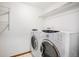 Bright laundry area equipped with a washer and dryer at 11196 E Baltic Dr, Aurora, CO 80014