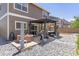 Backyard featuring a hot tub, stone landscaping, and privacy features at 217 Peabody St, Castle Rock, CO 80104