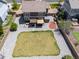 Spacious backyard featuring a large grass area, stone landscaping, and patio at 217 Peabody St, Castle Rock, CO 80104