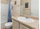 A well lit bathroom with a shower/tub combo and vanity with updated fixtures at 217 Peabody St, Castle Rock, CO 80104