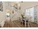 Bright dining room with a dining table, staircase, and decor, creating an inviting space for meals and gatherings at 217 Peabody St, Castle Rock, CO 80104