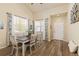 Inviting dining room featuring tile floors, windows, decor, and a dining table, perfect for entertaining guests at 217 Peabody St, Castle Rock, CO 80104