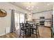 Bright kitchen featuring a table and chairs, stainless steel appliances, cabinetry, and tile flooring at 217 Peabody St, Castle Rock, CO 80104