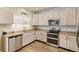 Bright kitchen with stainless steel appliances, including a double oven and modern fixtures at 217 Peabody St, Castle Rock, CO 80104