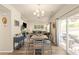 Inviting dining area and living room featuring hardwood floors and modern decor at 217 Peabody St, Castle Rock, CO 80104