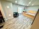 Spacious bedroom with wood floors, neutral walls, and a dedicated desk area at 3818 S Dallas St, Aurora, CO 80014