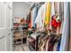 Walk-in closet featuring wire shelving with ample room for clothing, purses, and shoe storage at 3818 S Dallas St, Aurora, CO 80014