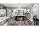 Open-concept dining area adjacent to kitchen, perfect for entertaining guests at 3818 S Dallas St, Aurora, CO 80014