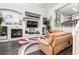Stylish living room boasts a modern fireplace, recessed lighting, and an open layout at 3818 S Dallas St, Aurora, CO 80014