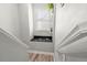 Stylish staircase with a decorative ledge, enhancing the home's interior design at 3818 S Dallas St, Aurora, CO 80014