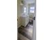 Bright bathroom featuring a vanity with sink, wood-look flooring, and natural light from the window at 1940 Quince St, Denver, CO 80220