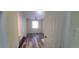 Bedroom with wood look floors and view to adjoining room, window provides natural light at 1940 Quince St, Denver, CO 80220
