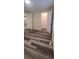 Spacious room with wood look flooring, closet doors, and access to another room at 1940 Quince St, Denver, CO 80220