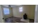 Well-lit bedroom with wood look flooring and window, small fireplace heater in the corner at 1940 Quince St, Denver, CO 80220