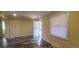 Bright living room featuring updated flooring and natural light from a window and glass door at 1940 Quince St, Denver, CO 80220
