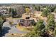An aerial view of the home with great curb appeal, mature landscaping, and an outbuilding at 4181 S Colorado Blvd, Cherry Hills Village, CO 80113