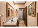 Charming bathroom with marble countertop, decorative mirror, and shower with curtain at 4181 S Colorado Blvd, Cherry Hills Village, CO 80113