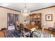 Bright dining room with hardwood floors, chandelier, and access to outdoor patio at 4181 S Colorado Blvd, Cherry Hills Village, CO 80113