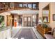 Elegant foyer with a grand staircase, high ceilings, checkered floors, and antique furnishings at 4181 S Colorado Blvd, Cherry Hills Village, CO 80113