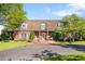 Charming brick home with a manicured lawn and inviting entryway at 4181 S Colorado Blvd, Cherry Hills Village, CO 80113