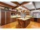 Spacious kitchen features wood cabinets, granite counters, large island, and professional appliances at 4181 S Colorado Blvd, Cherry Hills Village, CO 80113