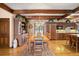 Expansive kitchen and dining area featuring wood beams, custom cabinets, and ample storage at 4181 S Colorado Blvd, Cherry Hills Village, CO 80113