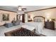 Spacious primary bedroom with upholstered sitting area, and comfortable seating at 4181 S Colorado Blvd, Cherry Hills Village, CO 80113