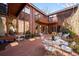 Inviting brick patio boasts comfortable seating, lush greenery, and a seamless blend of indoor-outdoor living at 4181 S Colorado Blvd, Cherry Hills Village, CO 80113