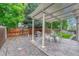 Spacious backyard with a privacy fence, pergola covered patio, mature trees, and a grill at 19149 E Ida Dr, Aurora, CO 80015