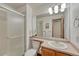 Well-lit bathroom with a glass-enclosed shower and modern vanity providing a clean and functional space at 19149 E Ida Dr, Aurora, CO 80015