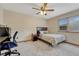 Bedroom featuring a bed, desk, window, dark furniture, neutral carpet, and a ceiling fan at 19149 E Ida Dr, Aurora, CO 80015
