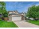 Beautiful home with an attached two car garage and mature landscaping at 19149 E Ida Dr, Aurora, CO 80015