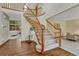 Inviting foyer with hardwood floors, staircase, and an open view to the living spaces at 19149 E Ida Dr, Aurora, CO 80015