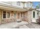 Close-up of the front porch with brick facade and decorative security door at 19149 E Ida Dr, Aurora, CO 80015