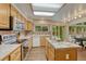 Open concept kitchen overlooking the backyard featuring updated appliances at 19149 E Ida Dr, Aurora, CO 80015