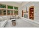 Bright living room with fireplace, built-in shelves, neutral color palette and an abundant source of light from windows at 19149 E Ida Dr, Aurora, CO 80015