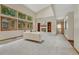 Spacious living room featuring vaulted ceilings and large windows, with fireplace at 19149 E Ida Dr, Aurora, CO 80015