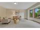 Cozy living room with neutral carpet, modern furniture, and a large bay window at 19149 E Ida Dr, Aurora, CO 80015