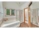 Main bathroom featuring a separate shower, soaking tub, and mirrored closet at 19149 E Ida Dr, Aurora, CO 80015