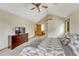 Neutral toned main bedroom features vaulted ceiling and en-suite bathroom access at 19149 E Ida Dr, Aurora, CO 80015