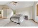 Spacious main bedroom with neutral tones, vaulted ceiling, and en-suite bathroom access at 19149 E Ida Dr, Aurora, CO 80015