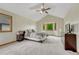 Bright main bedroom featuring cathedral ceilings, a bay window and cozy carpet flooring at 19149 E Ida Dr, Aurora, CO 80015