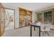 Spacious office with a full wall book case, natural light from the window and an open doorway at 19149 E Ida Dr, Aurora, CO 80015